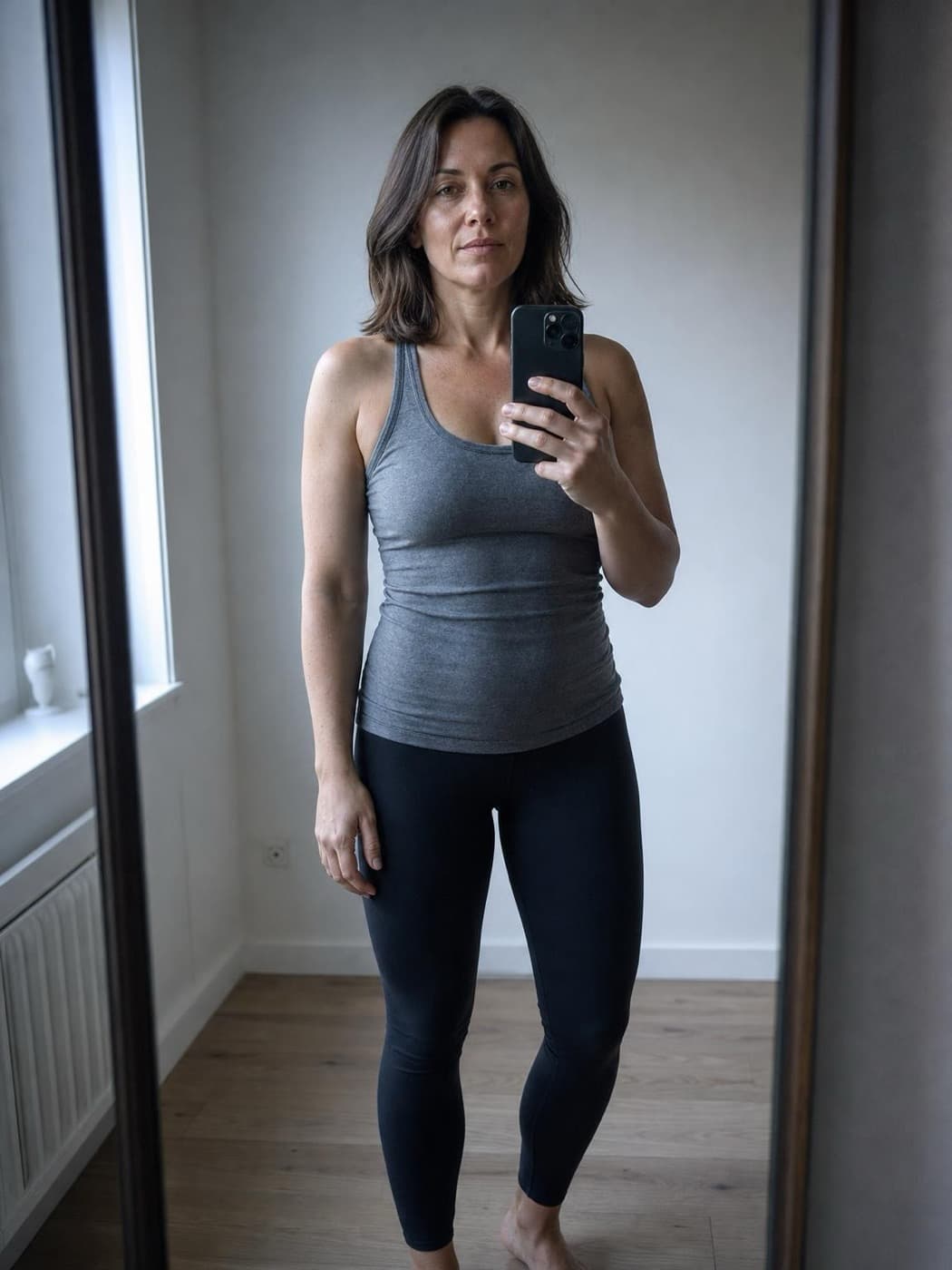 Mirror-selfie photo of an ordinary build, the same photo type the scan uses